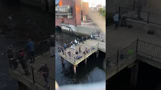 People fishing Paul Revere Park Boston Harbor Charles River Charlestown Massachusetts 2023
