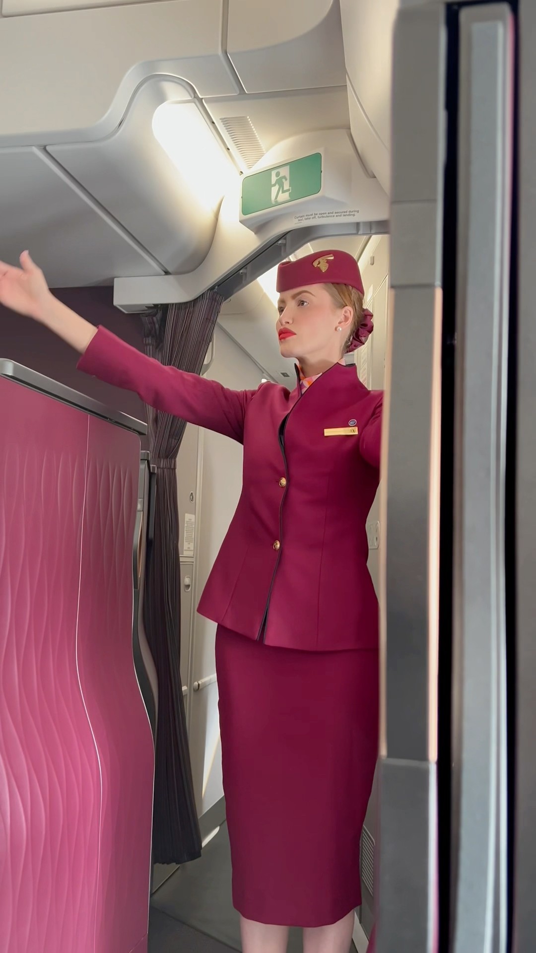 WHY DOES THIS FLIGHT ATTENDANT LOOK JUST LIKE ME ?