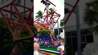 Gymnast hits head on traffic light during Miami Beach Gay Pride parade!