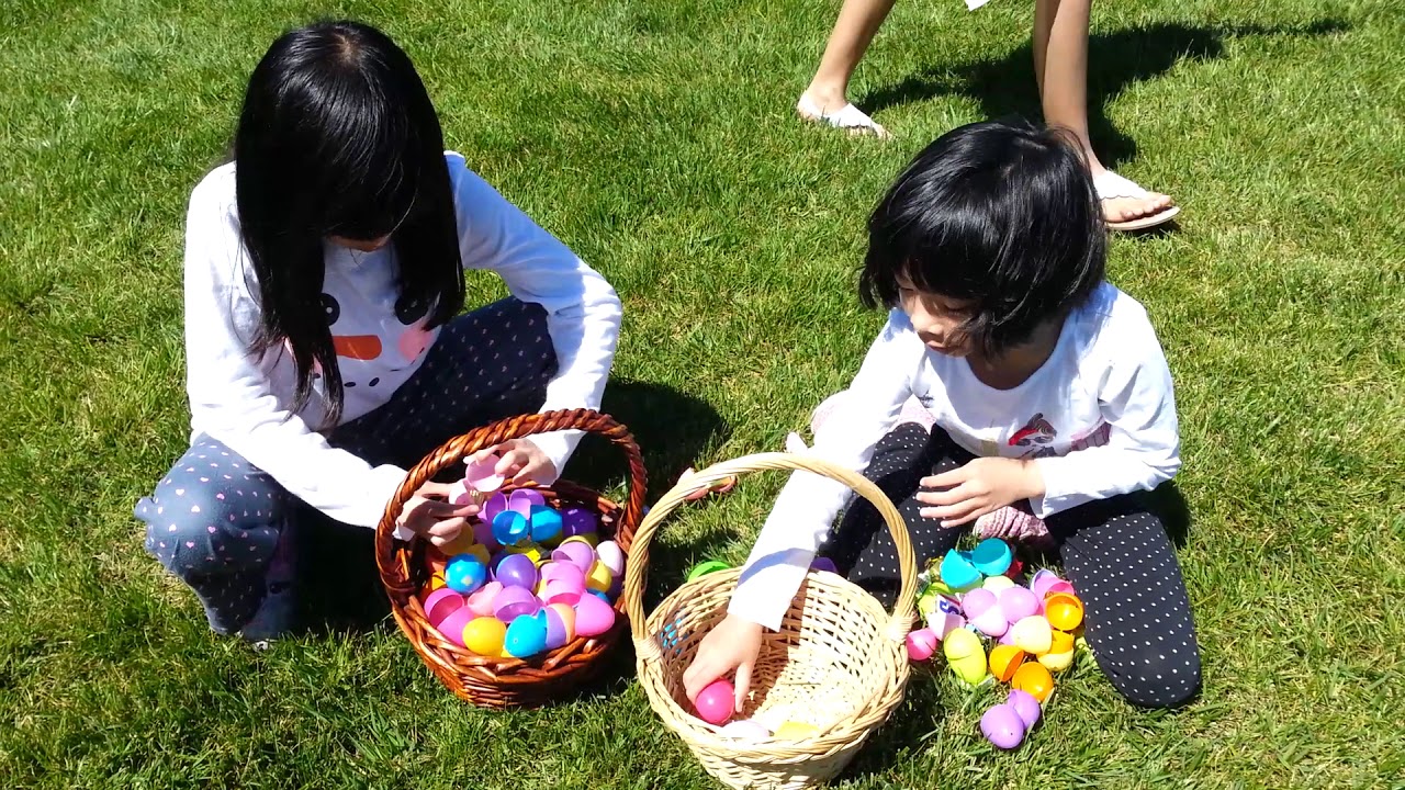 My girls open up their Easter eggs (looking for the golden egg inside)