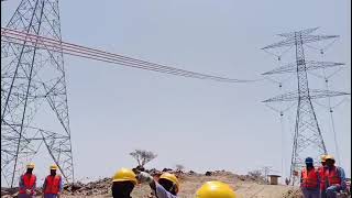 Stringing conductors pulling in progress for 380kV line Wealth