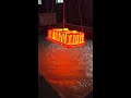 red-hot metal being submerged into a liquid bath May 19