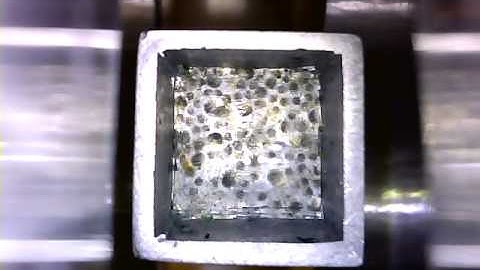 Rotating microcapsules in a 2D EMA system