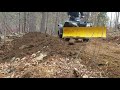 Snowplow on 4 wheeler pushing dirt