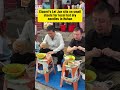 Xiaomi’s Lei Jun sits on small stools for local hot dry noodles in Huhan