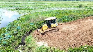 Komatsu D39px Bulldozer Pushing Dirt Ground Making New Road Crossing Big Lake With Dump Truck 5Ton