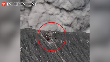 Climbers on rim of erupting volcano run for their lives