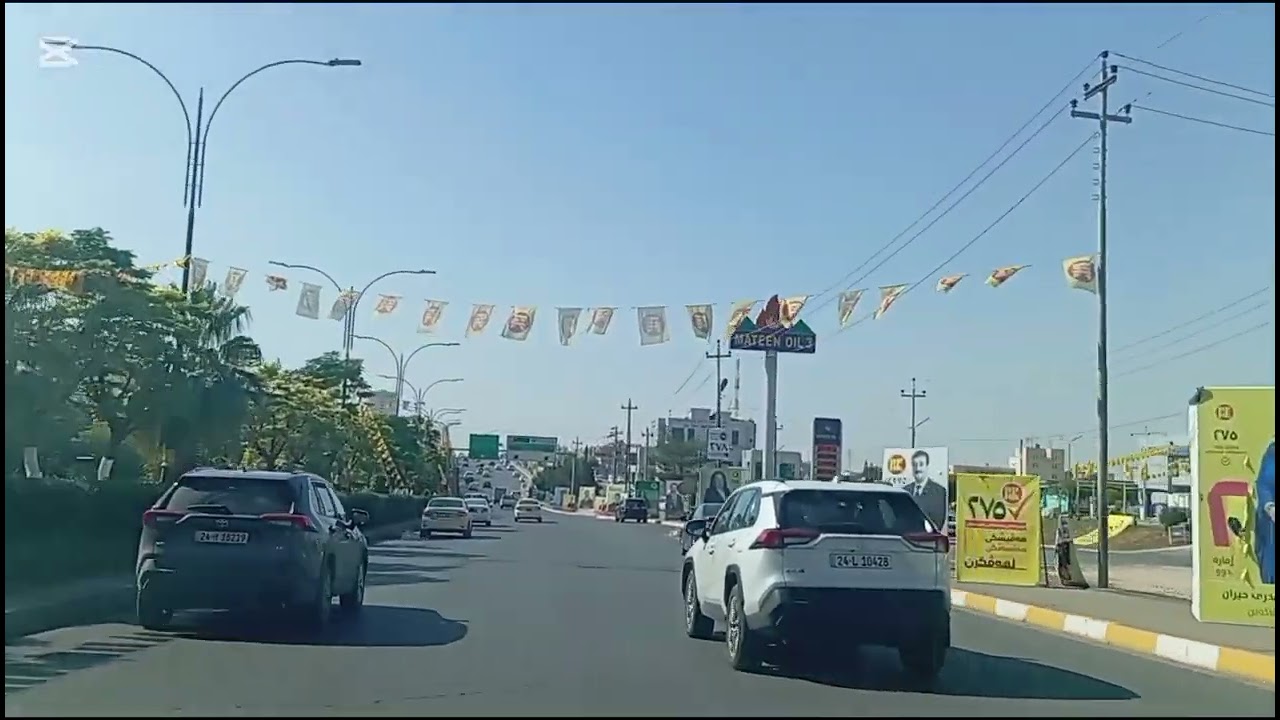 Driving tour in Duhok City Kurdistan Iraq Pictures of Iraqi parliament Candidates  cover the streets
