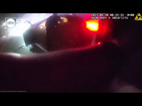 Florida police officers rescue driver from burning car after crash