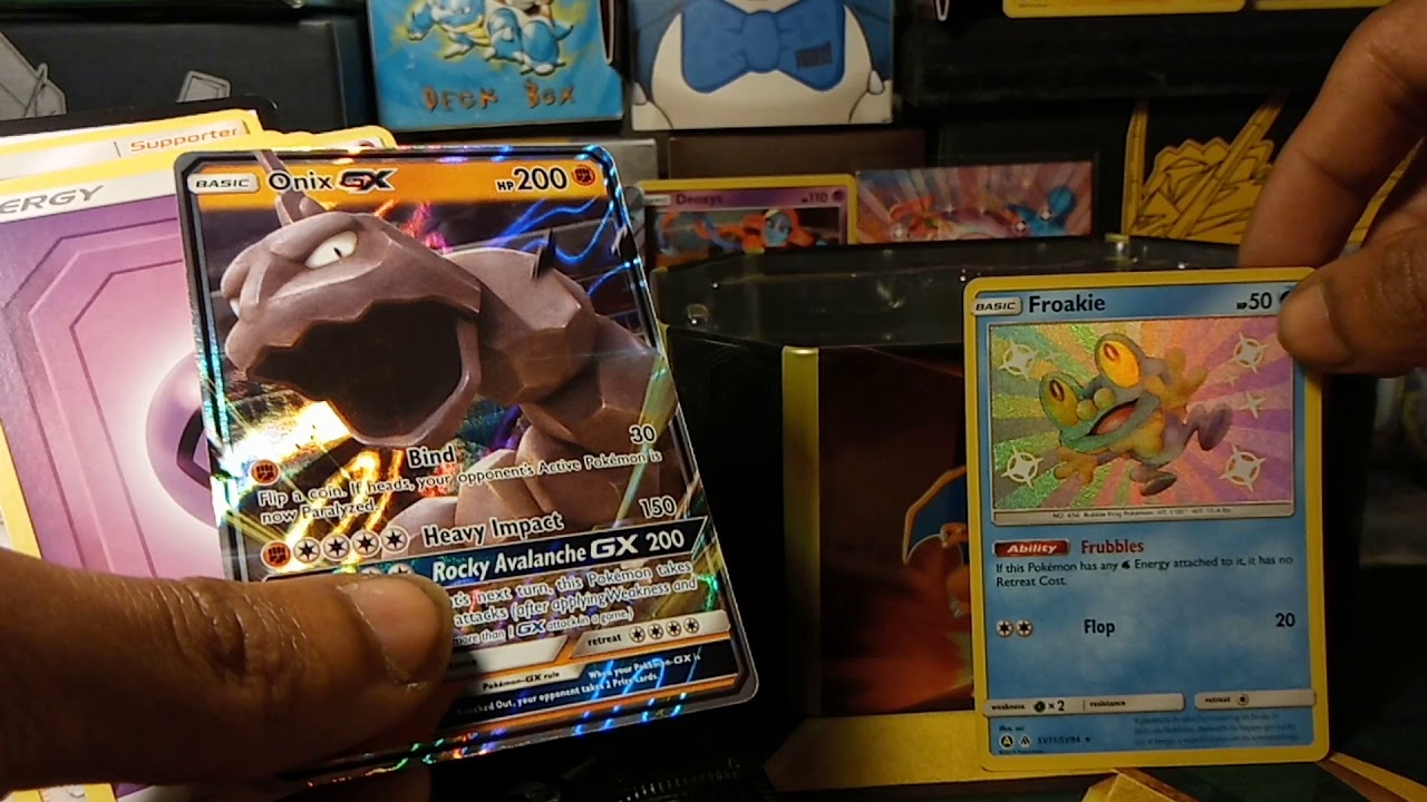 Opening a Gyarados GX HIDDEN FATES TIN PART 4 (SHINY FROAKIE ONIX GX PULLS)