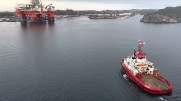 OIL RIG NORWAY - ( bringing semi sub oil rig into dry dock )