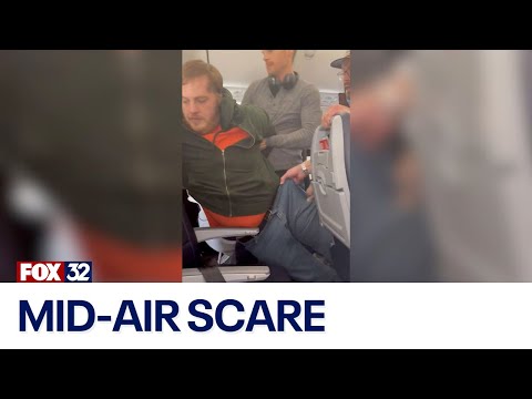Man tries to open plane door on American Airlines flight to Chicago