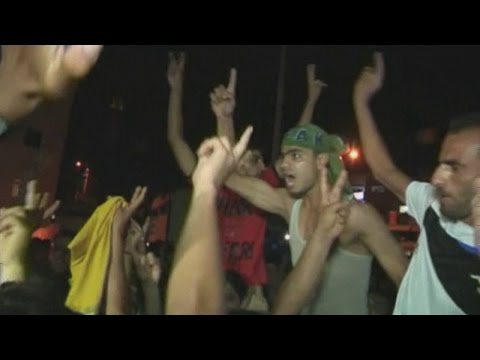 Palestinians celebrate in streets after Hamas 'capture' Israeli soldier