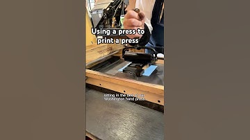Using a tabletop printing press on a press to print an image of a printing press