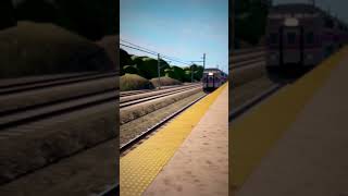 Amtrak veterans unit passing a stopped MBTA train at wickford junction