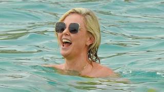 Charlize Theron Struts Her Stuff In A Figure Flattering Strapless Swimsuit For Beach Day In Mexico