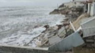 Tropical Storm Nicole topples beachfront homes