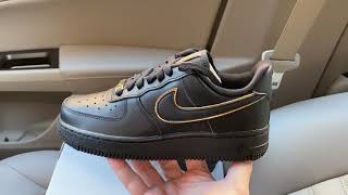 black nike with gold swoosh womens