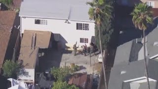 Suspect surrenders after East LA barricade