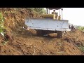 Aggressive looking Indian Bulldozer at work - Road construction