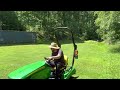 The John Deere 1023E makes easy mowing of tough terrain!