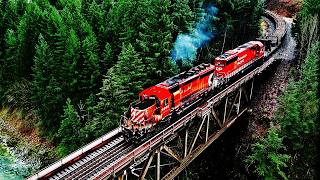 CP RAIL SD40 PULLS CONTINUOUS WELDED RAIL TRAIN BENDING THRU SHARP CURVES! 