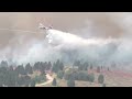 Air crews battle growing Sand Creek Fire as flames threaten more homes and ski area