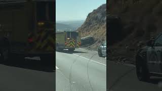 First Responders Arrive at Overturned Car on Highway