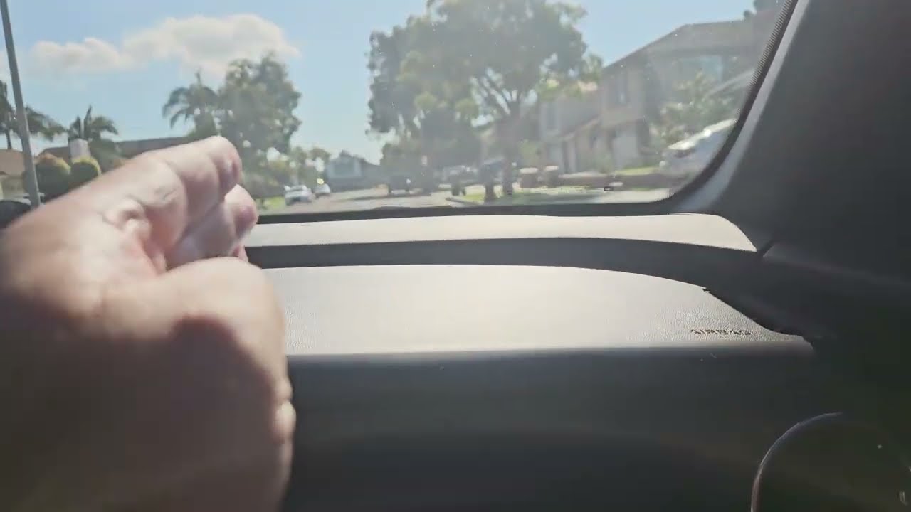 Crystal Prado wearing navy blue jeans with black belt and purple shirt tucked in 