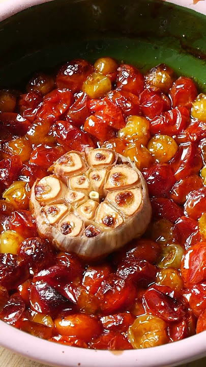 Slow roasted garlic and tomatoes with olive oil and balsamic glaze on toast with burrata