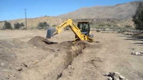 Santana DeLao Demonstrates how to dig a trench  with a John Deere 710 Backhoe