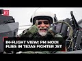 Pm modi flies in tejas fighter jet shares inflight view from the indigenously built aircraft