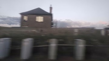 Blea Moor Signal Box and crossing Ribblehead viaduct on a class 158 in the early evening 