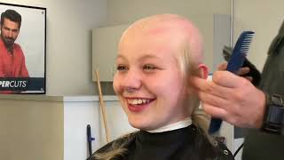 Pretty young blond girl shaves her head to zero for charity in salon
