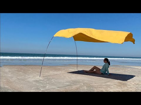 Video: How to make a beach canopy from the sun with your own hands