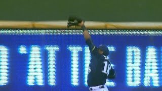 Davis slams into left-field wall for the out