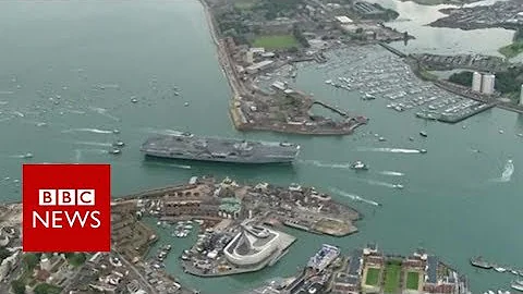 Aerial video of HMS Queen Elizabeth arriving in Portsmouth- BBC News