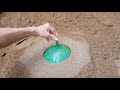 Using cement, create a spherical stone block