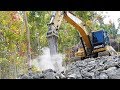 Excavator With Hydraulic Hammer Breaking Rock CAT 320D