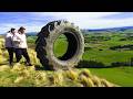 Extreme tire jumping down a mountain