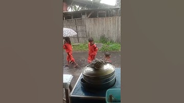 heavy rain cheerful country boy taking a rain shower #shorts
