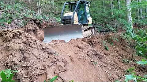 Cat D6K2 cutting a log road