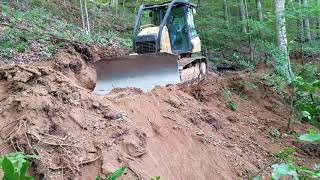 Cat D6K2 cutting a log road