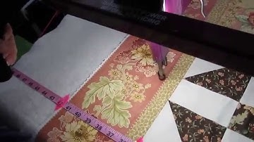 Long arm quilting a leafy feather