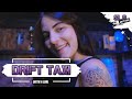 Annie chirps while riding in drift taxi.