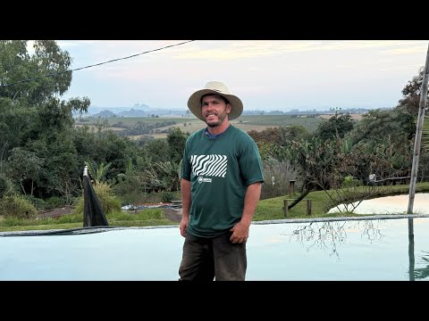HE LIVES A SIMPLE AND JOYFUL LIFE IN A DOORLESS CABIN IN THE MOUNTAINS.