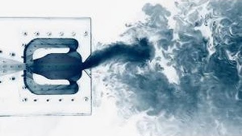 Lagrangian coherent structures in the flow field of a fluidic oscillator