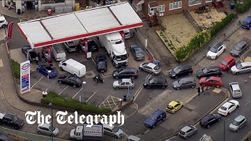 Aerial footage shows queues for fuel endure despite attempts to reassure drivers