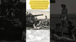 U S  Army Nurses sunbathing next to a twin Bofors 40 mm gun on a Coast Guard troop ship returning ba