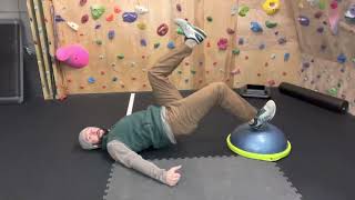 Glute bridge alternating heel strike on BOSU